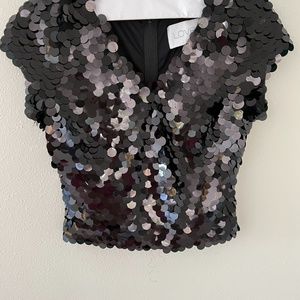 Sequin top - runs very small.   Tag says L but this is more like a Small